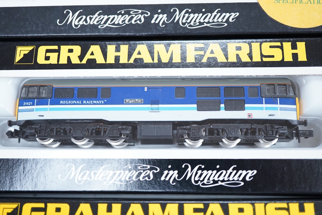 Four boxed Graham Farish N gauge railway diesel and electric locomotives; a BR class 20, D8144 (8204), a Regional Railways class 31, Wigan Pier 31421 (8067), a BR class 08, 08 834, (1002) and an Intercity class 91, 91005